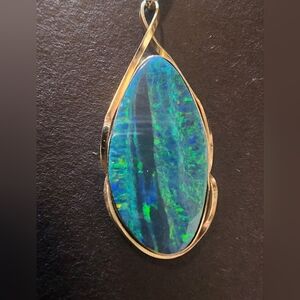 Australian boulder doublet opal pendant set in 14k gold